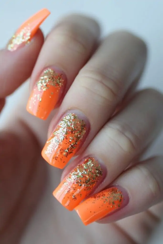 Orange and Gold Glitter Nail Design